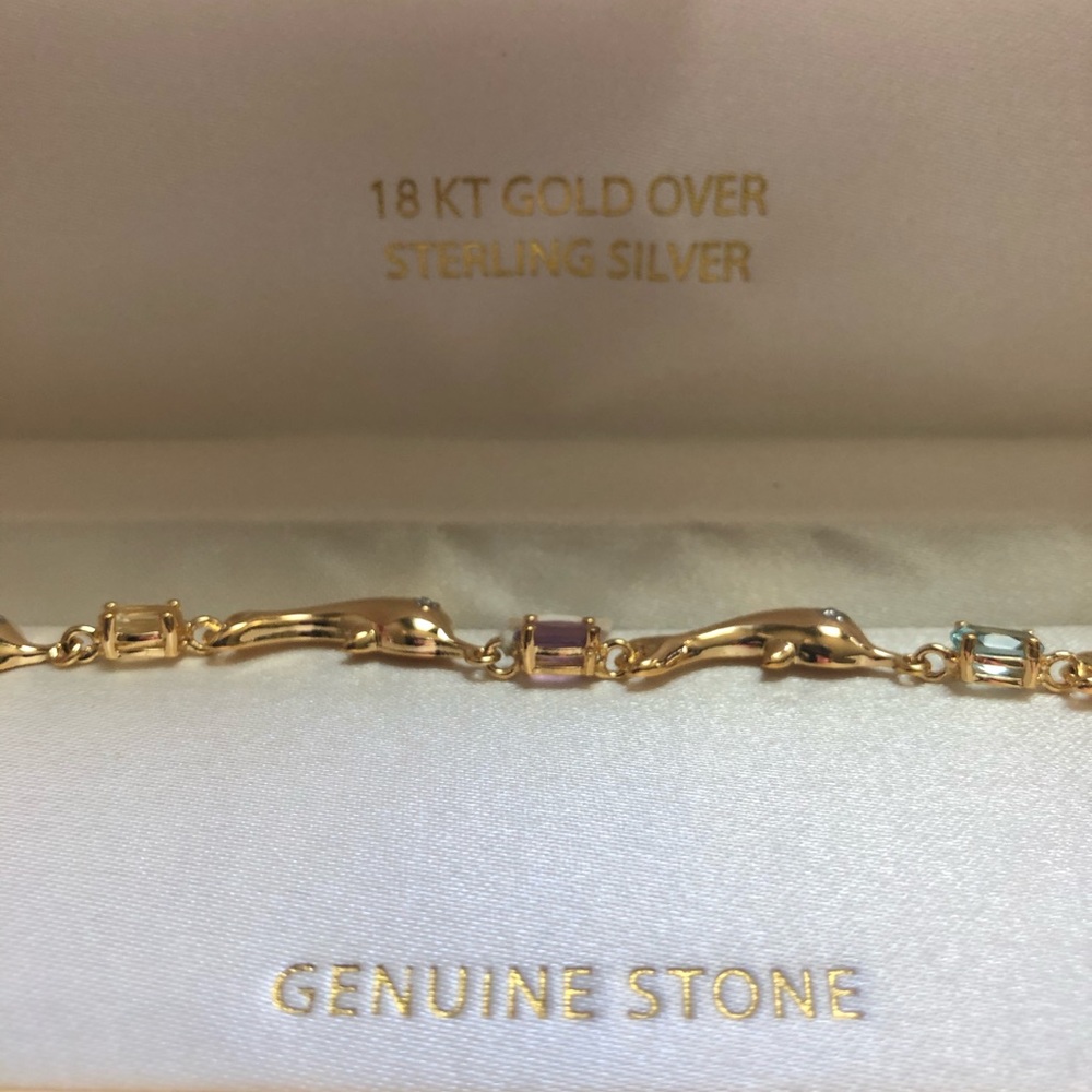 18 kt gold Dolphin bracelet with genuine stones